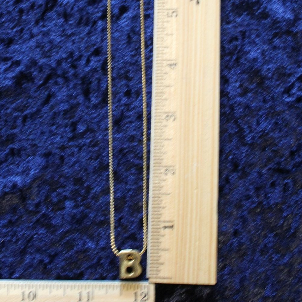 B Charm on gold tone necklace